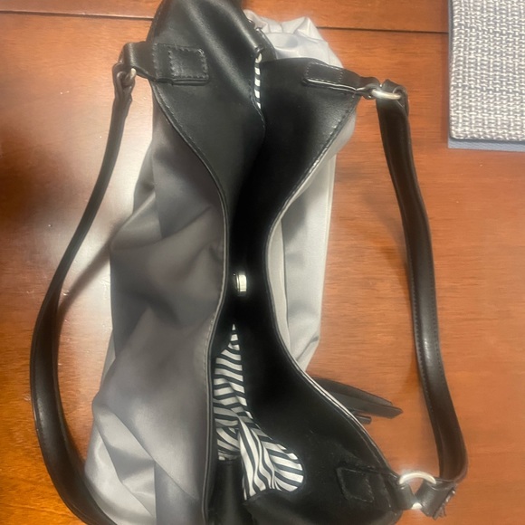 Silver toned handbag. black and white striped lining. Black straps. Waterproof. - Picture 4 of 4